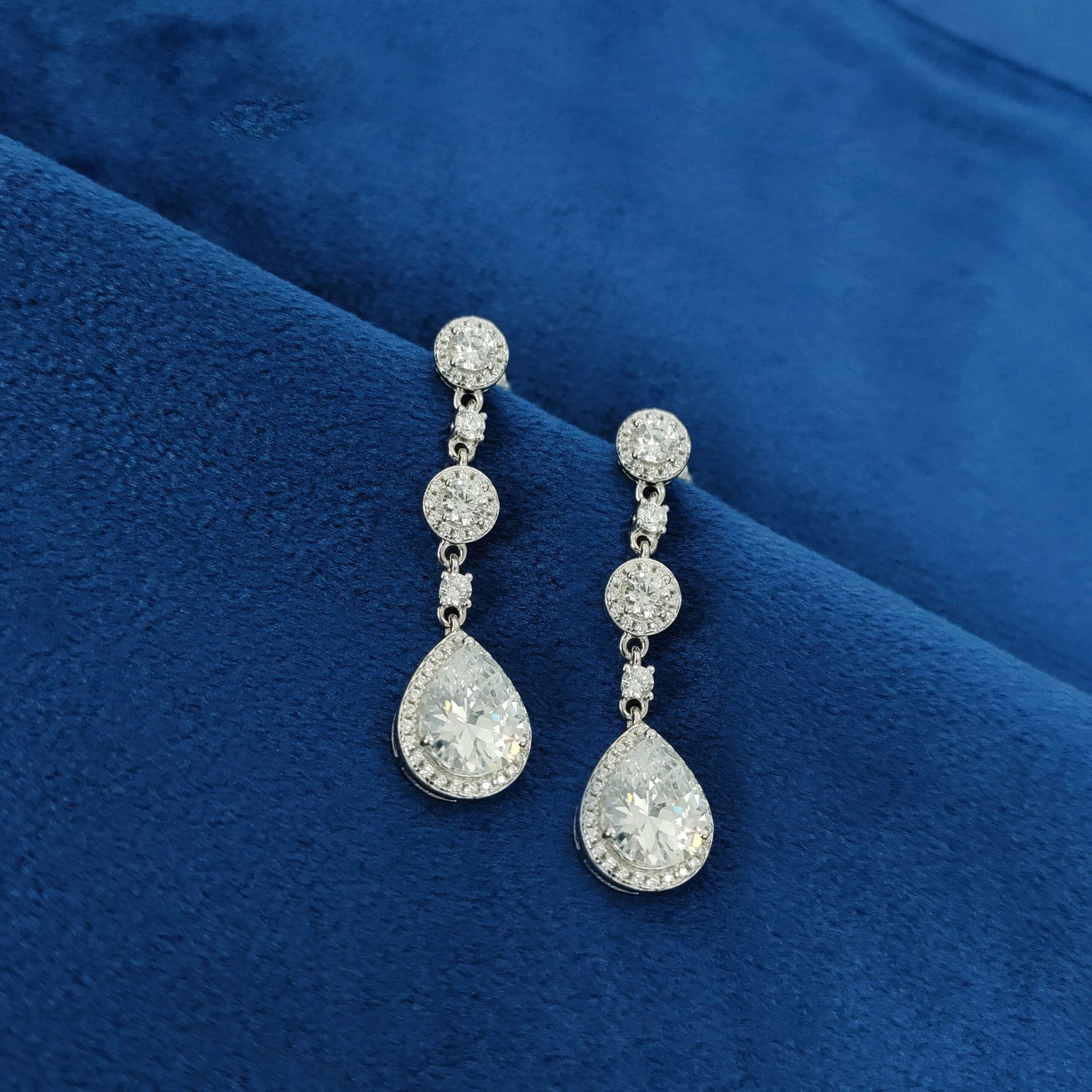 "Silver earrings for Indian festivals, crafted from sterling silver with traditional designs for a festive look."