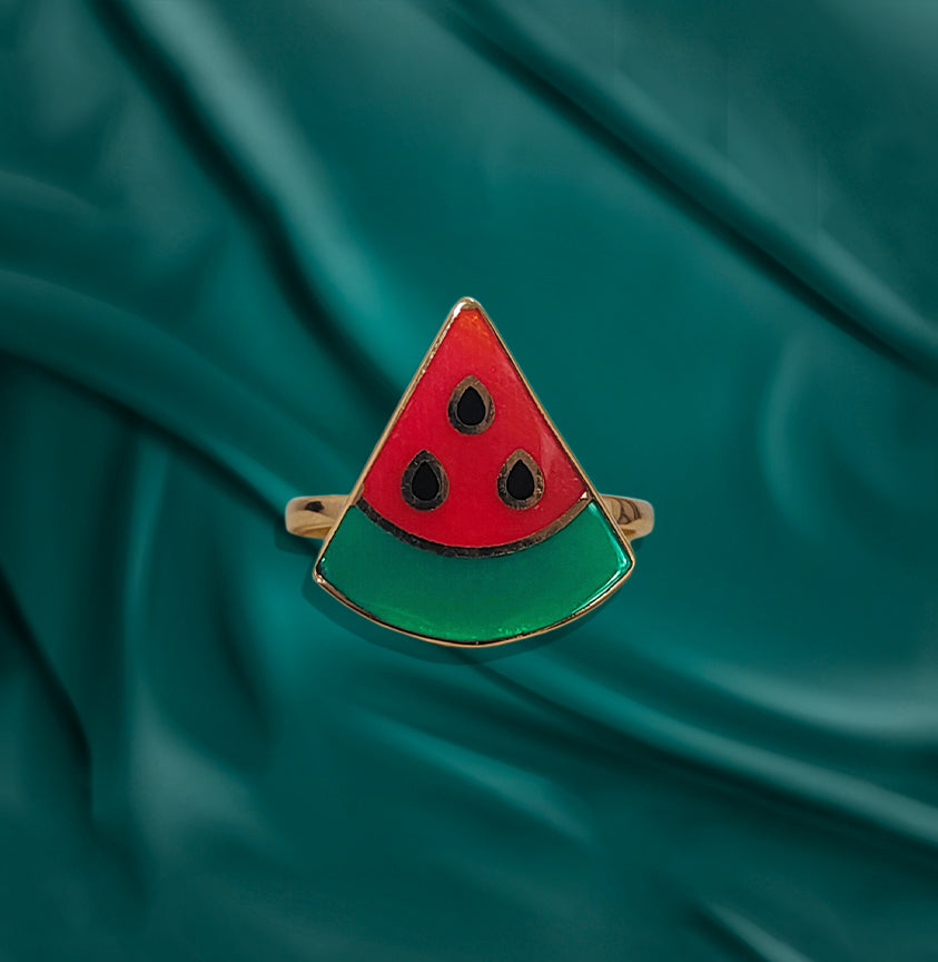 "Watermelon-shaped baby rings in 18kt gold, hypoallergenic and fun."